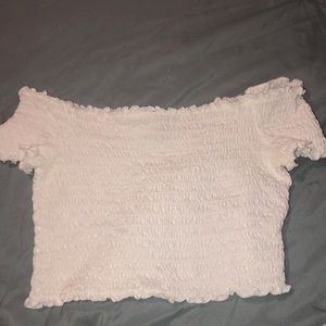 White off the shoulders crop top and is thick material, worn once.